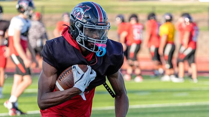 Safety Gabriel Osborne Jr. participates in a drill during football practice at Mustang High School in Mustang, Okla., on Friday, Aug. 15, 2025.