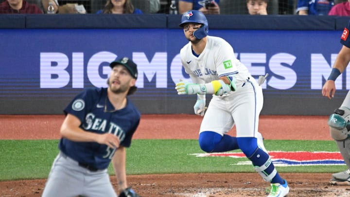 Apr 19, 2025; Toronto, Ontario, CAN; Toronto Blue Jays shortstop Bo Bichette (11) hits an RBI single off Seattle Mariners pitch Collin Snider (52) in the sixth inning at Rogers Centre. Mandatory Credit: Dan Hamilton-Imagn Images Apr 19, 2025; Toronto, Ontario, CAN; Toronto Blue Jays shortstop Bo Bichette (11) hits an RBI single off Seattle Mariners pitch Collin Snider (52) in the sixth inning at Rogers Centre. Mandatory Credit: Dan Hamilton-Imagn Images