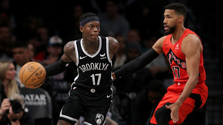 Apr 10, 2024; Brooklyn, New York, USA; Brooklyn Nets guard Dennis Schroder (17) handles the ball against Toronto Raptors forward Garrett Temple (17) during the third quarter at Barclays Center. Mandatory Credit: Brad Penner-Imagn Images
