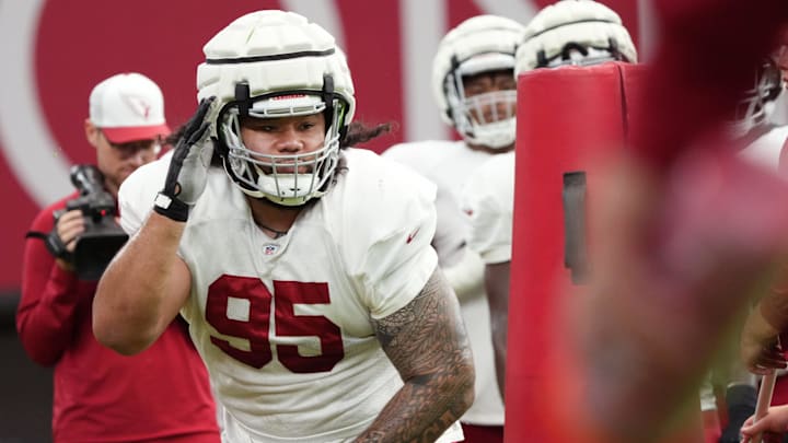 Arizona Cardinals defensive lineman Khyiris Tonga (95) works through a drill during training camp at State Farm Stadium in Glendale, Ariz., on Monday, July 29, 2024.