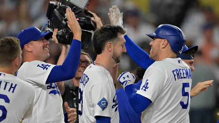 Los Angeles Dodgers first baseman Freddie Freeman (5) is congratulated pitcher Blake Treinen (49) and right fielder Kyle Tucker (23) after hitting a walk-off home run in the ninth inning against the Los Angeles Angels at Dodger Stadium on June 5, 2026.