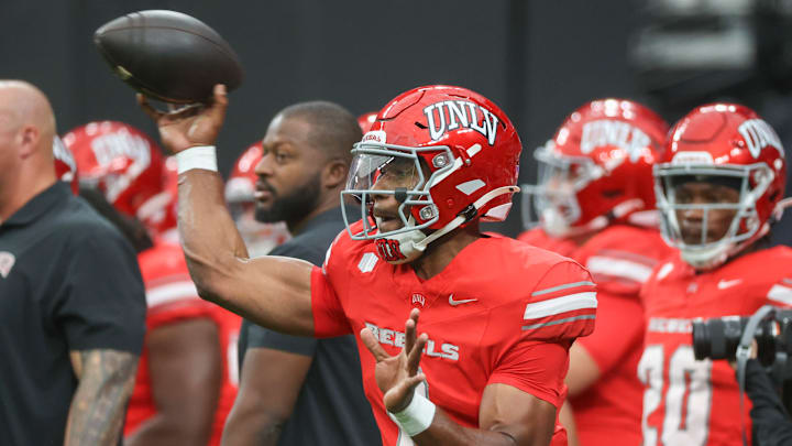 Hajj-Malik Williams #6 of the UNLV Rebels warms up prior to a game against the Fresno State Bulldogs at Allegiant Stadium on September 28, 2024 in Las Vegas, Nevada.