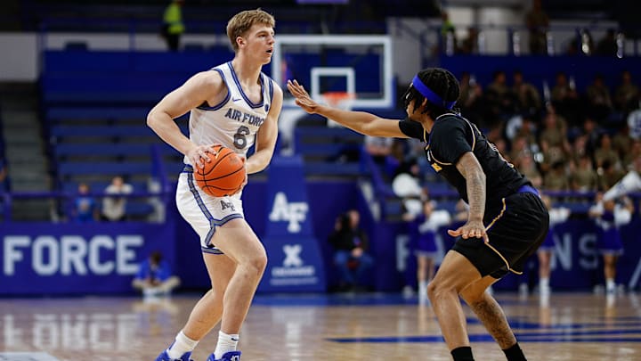 Jan 11, 2025; Colorado Springs, Colorado, USA; Air Force Falcons forward Will Cooper (6) controls the ball as San Jose State Spartans guard Donavan Yap Jr. (0) guards in the second half at Clune Arena.