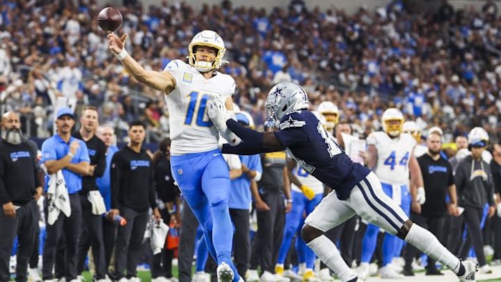 Dec 21, 2025; Arlington, Texas, USA; Los Angeles Chargers quarterback Justin Herbert (10) passes against the Dallas Cowboys during the fourth quarter at AT&T Stadium. Mandatory Credit: Kevin Jairaj-Imagn Images