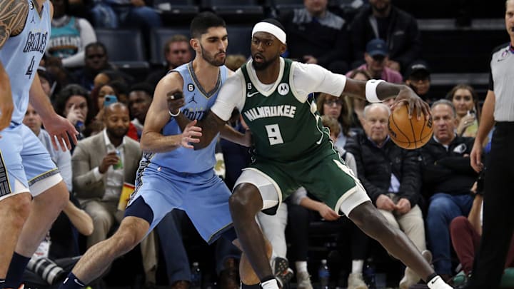 Dec 15, 2022; Memphis, Tennessee, USA; Milwaukee Bucks forward Bobby Portis (9) dribbles as Memphis Grizzlies forward Santi Aldama (7) defends during the second half at FedExForum. Mandatory Credit: Petre Thomas-Imagn Images