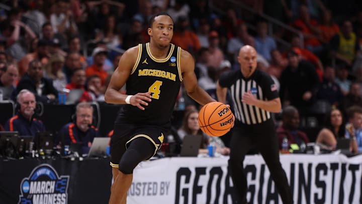 Mar 28, 2025; Atlanta, GA, USA; Michigan Wolverines guard Nimari Burnett (4) dribbles in the second half of a South Regional semifinal of the 2025 NCAA tournament against the Auburn Tigers at State Farm Arena. Mandatory Credit: Brett Davis-Imagn Images