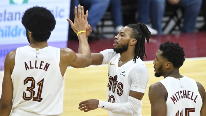 Nov 26, 2023; Cleveland, Ohio, USA; Cleveland Cavaliers center Jarrett Allen (31), guard Darius Garland (10), and guard Donovan Mitchell (45) celebrate in the fourth quarter against the Toronto Raptors at Rocket Mortgage FieldHouse. Mandatory Credit: David Richard-Imagn Images