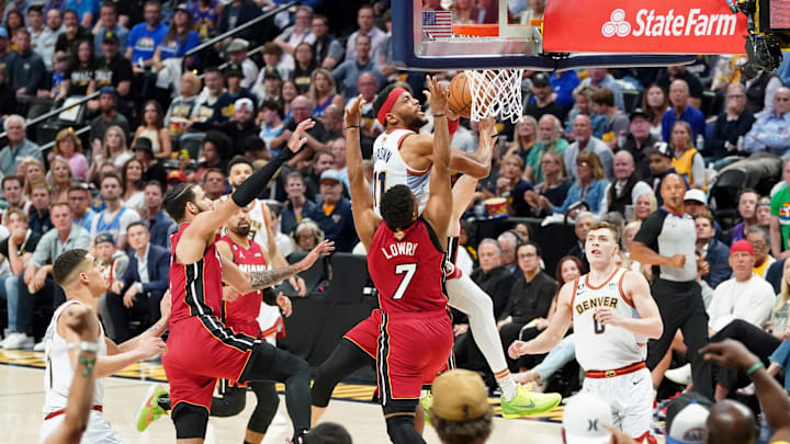 Jun 12, 2023; Denver, Colorado, USA; Denver Nuggets forward Bruce Brown (11) shoots the ball against Miami Heat guard Kyle Lowry (7) during the first half in game five of the 2023 NBA Finals at Ball Arena. Mandatory Credit: Kyle Terada-Imagn Images