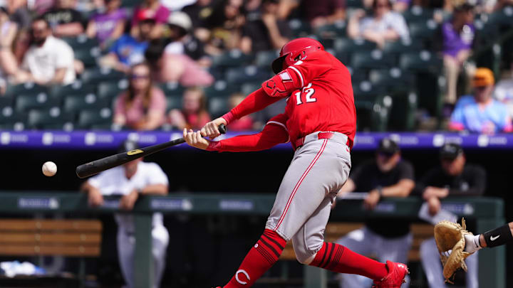 Apr 27, 2025; Denver, Colorado, USA; Cincinnati Reds outfielder Austin Hays (12) doubles in the ninth inning against the Colorado Rockies at Coors Field. Mandatory Credit: Ron Chenoy-Imagn Images