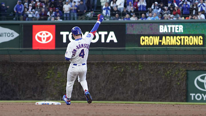 Apr 27, 2025; Chicago, Illinois, USA; Chicago Cubs outfielder Pete Crow-Armstrong (4) gestures after hitting a one run double against the Philadelphia Phillies during the second inning at Wrigley Field. Mandatory Credit: David Banks-Imagn Images