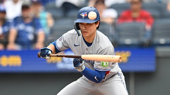 Sep 3, 2026; Cleveland, Ohio, USA; Toronto Blue Jays center fielder Brett Bateman (21) hits a bunt single during the fifth inning against the Cleveland Guardians at Progressive Field. Mandatory Credit: Ken Blaze-Imagn Images
