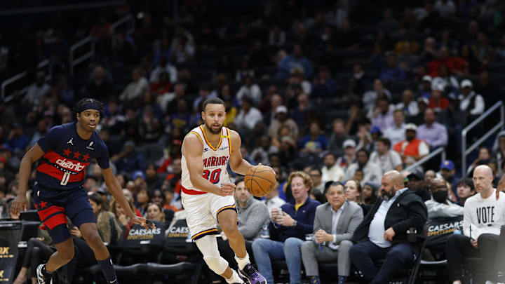Nov 4, 2024; Washington, District of Columbia, USA; Golden State Warriors guard Stephen Curry (30) drives to the basket past Washington Wizards guard Bilal Coulibaly (0) in the second half at Capital One Arena. Mandatory Credit: Geoff Burke-Imagn Images