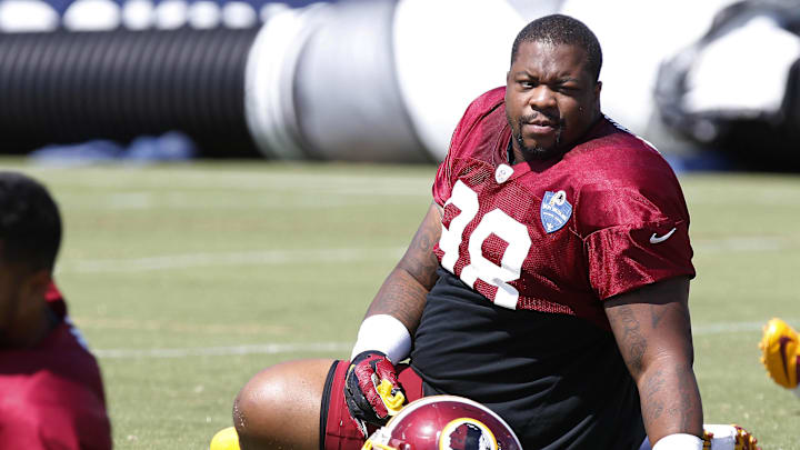 Aug 1, 2015; Richmond, VA, USA; Washington Redskins defensive tackle Terrance Knighton (98) stretches on the field during afternoon practice as part of day three of training camp at Bon Secours Washington Redskins Training Center. Mandatory Credit: Geoff Burke-Imagn Images
