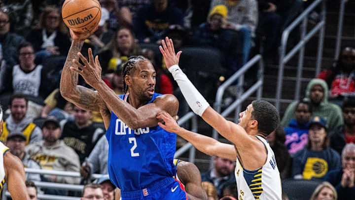 LA Clippers forward Kawhi Leonard (2) looks to pass the ball while Indiana Pacers guard Tyrese Haliburton (0) defends in the second half at Gainbridge Fieldhouse. Mandatory Credit: Trevor Ruszkowski-Imagn Images