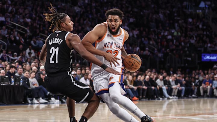 Nov 17, 2024; New York, New York, USA;  New York Knicks center Karl-Anthony Towns (32) collides with Brooklyn Nets forward Noah Clowney (21) in the third quarter at Madison Square Garden. Mandatory Credit: Wendell Cruz-Imagn Images