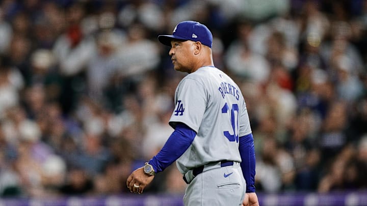 Sep 27, 2024; Denver, Colorado, USA; Los Angeles Dodgers manager Dave Roberts (30) walks to the mound in the seventh inning against the Colorado Rockies at Coors Field. Mandatory Credit: Isaiah J. Downing-Imagn Images