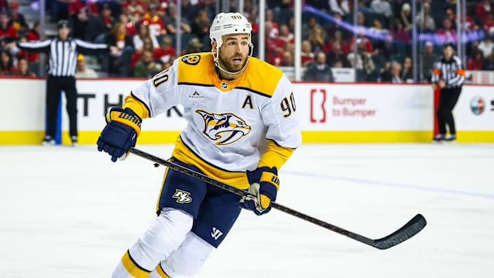 Jan 4, 2025; Calgary, Alberta, CAN; Nashville Predators center Ryan O'Reilly (90) skates against the Calgary Flames during the third period at Scotiabank Saddledome. Mandatory Credit: Sergei Belski-Imagn Images