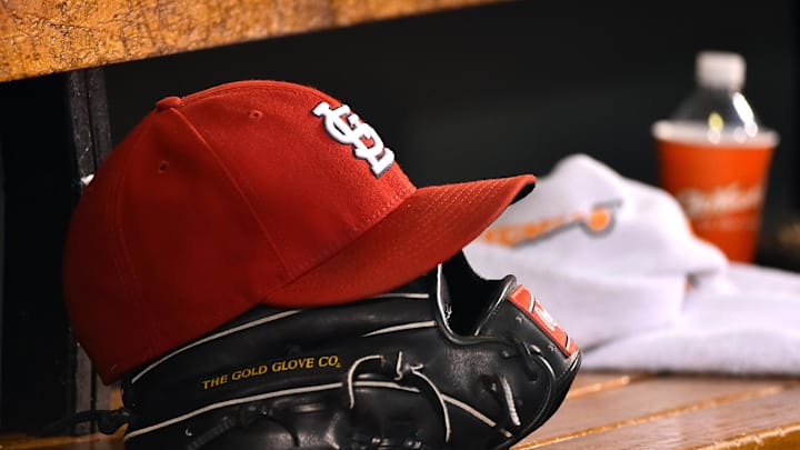 Aug 15, 2015; St. Louis, MO, USA; A detailed view of a baseball glove and St. Louis Cardinals hat in the dugout during the game between the Cardinals and the Miami Marlins at Busch Stadium. Mandatory Credit: Jasen Vinlove-Imagn Images