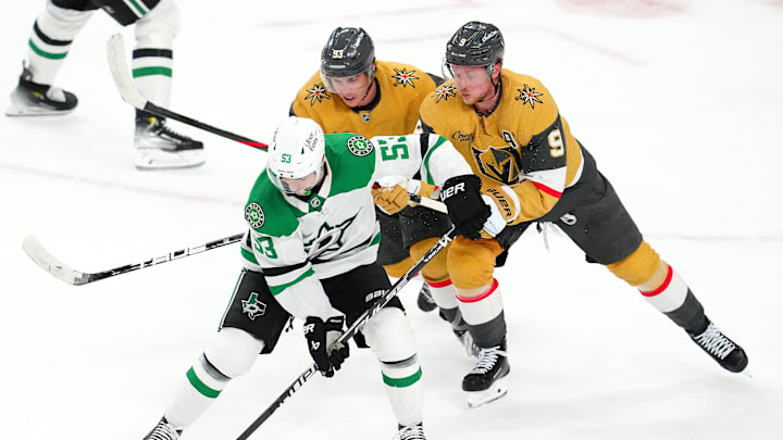 Jan 29, 2026; Las Vegas, Nevada, USA; Dallas Stars center Wyatt Johnston (53) controls the puck ahead of Vegas Golden Knights right wing Mitch Marner (93) and center Jack Eichel (9) during an overtime period at T-Mobile Arena. Mandatory Credit: Stephen R. Sylvanie-Imagn Images
