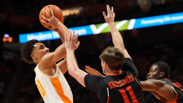 Tennessee forward Nate Ament (10) with the shot attempt while guarded by Mercer guard Brady Shoulders (11) in NCAA college basketball game on November 3, 2025, in Knoxville, Tenn.