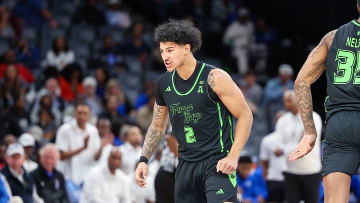 Mar 5, 2026; Memphis, Tennessee, USA; South Florida Bulls guard Wes Enis (2) reacts after a three point basket against the Memphis Tigers during the second half at FedExForum. Mandatory Credit: Wesley Hale-Imagn Images