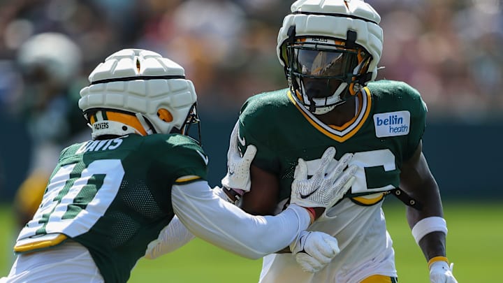 Green Bay Packers cornerbacks LJ Davis (40) and Corey Ballentine (26) run through a drill during practice on Wednesday, August 14, 2024, at Ray Nitschke Field in Ashwaubenon, Wis.