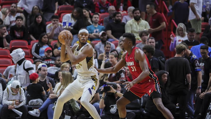 Nov 30, 2023; Miami, Florida, USA; Indiana Pacers center Myles Turner (33) protects the basketball from Miami Heat center Thomas Bryant (31) during the third quarter at Kaseya Center. Mandatory Credit: Sam Navarro-Imagn Images Nov 30, 2023; Miami, Florida, USA; Indiana Pacers center Myles Turner (33) protects the basketball from Miami Heat center Thomas Bryant (31) during the third quarter at Kaseya Center. Mandatory Credit: Sam Navarro-Imagn Images