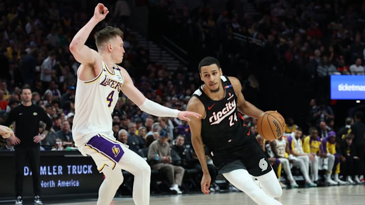Apr 13, 2025; Portland, Oregon, USA; Portland Trail Blazers forward Kris Murray (24) dribbles the ball past Los Angeles Lakers guard Dalton Knecht (4) in the first half at Moda Center. Mandatory Credit: Jaime Valdez-Imagn Images Apr 13, 2025; Portland, Oregon, USA; Portland Trail Blazers forward Kris Murray (24) dribbles the ball past Los Angeles Lakers guard Dalton Knecht (4) in the first half at Moda Center. Mandatory Credit: Jaime Valdez-Imagn Images