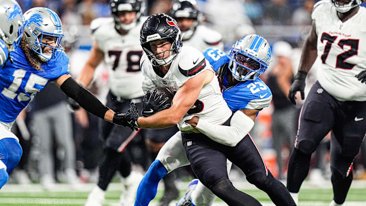Detroit Lions cornerback Rock Ya-Sin (23) tackles Houston Texans tight end Harrison Bryant (88) during the first half at Ford Field in Detroit on Saturday, August 23, 2025. Detroit Lions cornerback Rock Ya-Sin (23) tackles Houston Texans tight end Harrison Bryant (88) during the first half at Ford Field in Detroit on Saturday, August 23, 2025.