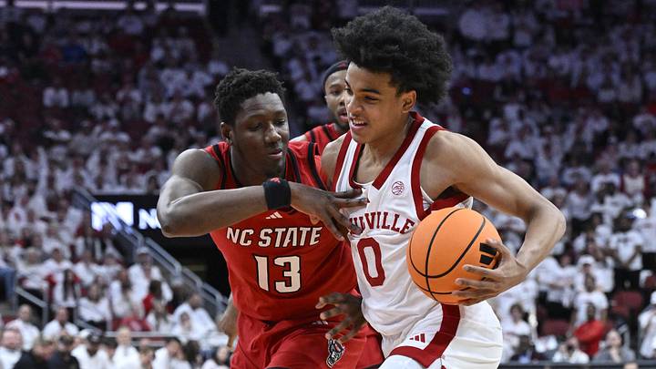 Feb 9, 2026; Louisville, Ky.; Louisville guard Mikel Brown Jr. (0) drives to the basket against NC State forward Musa Sagnia (13).