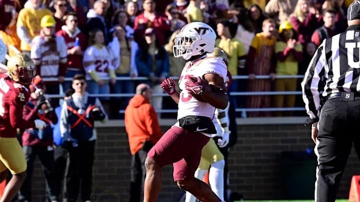 Nov 11, 2023; Chestnut Hill, Massachusetts, USA; Virginia Tech Hokies running back Bhayshul Tuten (33) scores a touchdown during the first half against the Boston College Eagles at Alumni Stadium. Mandatory Credit: Eric Canha-Imagn Images