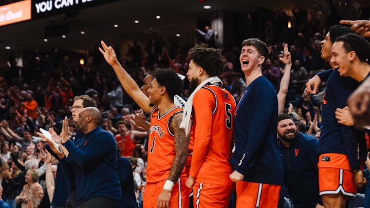 Feb 21, 2026; Charlottesville, Virginia, USA; Virginia Cavaliers celebrate during the first half against the Miami (FL) Hurricanes at John Paul Jones Arena. Mandatory Credit: Emily Faith Morgan-Imagn Images