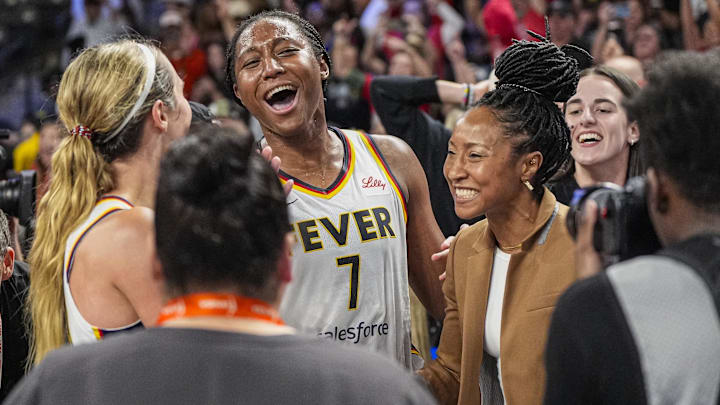 Sep 18, 2025; College Park, Georgia, USA; Indiana Fever players including guard Lexie Hull (10) and forward Aliyah Boston (7) react after defeating the Atlanta Dream during game three of round one for the 2025 WNBA Playoffs at Gateway Center Arena at College Park. Mandatory Credit: Dale Zanine-Imagn Images