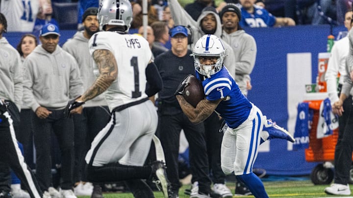 Dec 31, 2023; Indianapolis, Indiana, USA; Indianapolis Colts wide receiver Josh Downs (1) runs with the ball after the catch while Las Vegas Raiders safety Marcus Epps (1) defends in the first quarter at Lucas Oil Stadium. Mandatory Credit: Trevor Ruszkowski-Imagn Images Dec 31, 2023; Indianapolis, Indiana, USA; Indianapolis Colts wide receiver Josh Downs (1) runs with the ball after the catch while Las Vegas Raiders safety Marcus Epps (1) defends in the first quarter at Lucas Oil Stadium. Mandatory Credit: Trevor Ruszkowski-Imagn Images