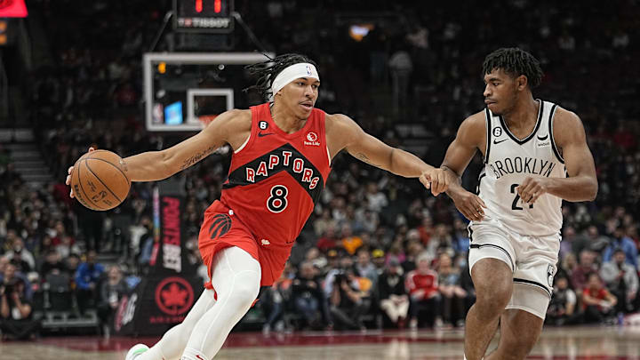 Nov 23, 2022; Toronto, Ontario, CAN; Toronto Raptors guard Ron Harper Jr. (8) drives to the net against Brooklyn Nets guard Cam Thomas (24) during the second half at Scotiabank Arena. Mandatory Credit: John E. Sokolowski-Imagn Images