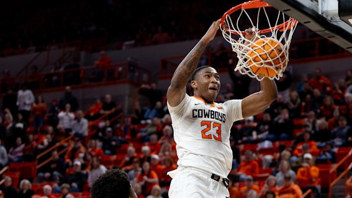 Jan 6, 2024; Stillwater, Okla, USA; Oklahoma State Cowboys center Brandon Garrison (23) slam dunks