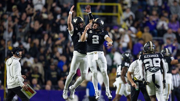 Nov 23, 2024; Baton Rouge, Louisiana, USA;  Vanderbilt Commodores quarterback Diego Pavia (2) reacts to throwing a touchdown pass against the LSU Tigers during the first half at Tiger Stadium. Mandatory Credit: Stephen Lew-Imagn Images