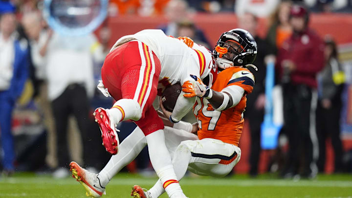 Nov 16, 2025; Denver, Colorado, USA; Denver Broncos cornerback Ja'Quan McMillian (29) sacks Kansas City Chiefs quarterback Patrick Mahomes (15) in the fourth quarter at Empower Field at Mile High. Mandatory Credit: Ron Chenoy-Imagn Images