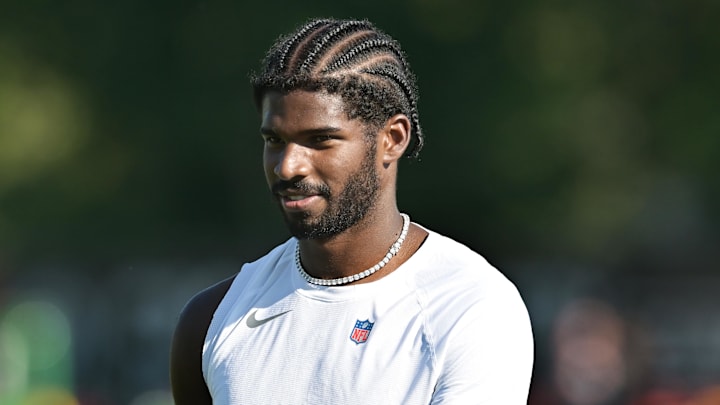 Jul 23, 2025; Berea, OH, USA; Cleveland Browns quarterback Shedeur Sanders (12) walks off the field during training camp at CrossCountry Mortgage Campus. 