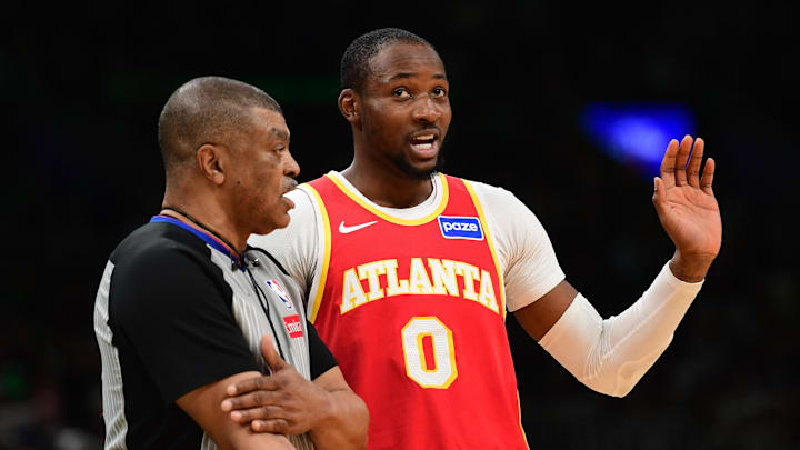 Mar 27, 2026; Boston, Massachusetts, USA; Atlanta Hawks forward Jonathan Kuminga (0) talks with an official during the second half against the Boston Celtics at TD Garden. Mandatory Credit: Bob DeChiara-Imagn Images