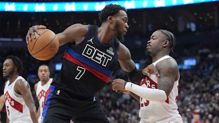 Feb 11, 2026; Toronto, Ontario, CAN; Detroit Pistons center Paul Reed (7) controls the ball against Toronto Raptors guard Jamal Shead (23) during the first half at Scotiabank Arena. Mandatory Credit: John E. Sokolowski-Imagn Images