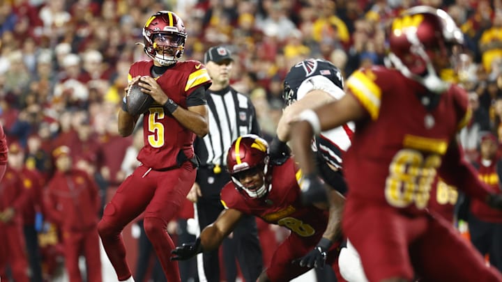 Dec 29, 2024; Landover, Maryland, USA; Washington Commanders quarterback Jayden Daniels (5) prepares to throw the ball against the Atlanta Falcons during the first half at Northwest Stadium. Mandatory Credit: Amber Searls-Imagn Images