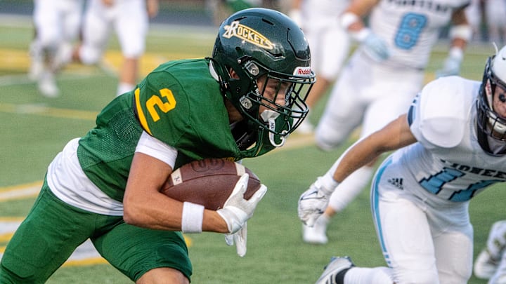 Reynolds Wesley Rumbough carries the ball in the game against Watauga.