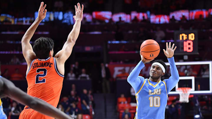 Nov 22, 2025; Champaign, Illinois, USA; Long Island University Sharks guard A.J. Neal, Jr. (10) shoots the ball over Illinois Fighting Illini guard Andrej Stojakovic (2) during the second half at State Farm Center. Mandatory Credit: Ron Johnson-Imagn Images Nov 22, 2025; Champaign, Illinois, USA; Long Island University Sharks guard A.J. Neal, Jr. (10) shoots the ball over Illinois Fighting Illini guard Andrej Stojakovic (2) during the second half at State Farm Center. Mandatory Credit: Ron Johnson-Imagn Images