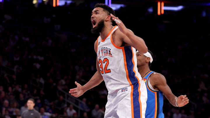 Jan 10, 2025; New York, New York, USA; New York Knicks center Karl-Anthony Towns (32) reacts in front of Oklahoma City Thunder guard Shai Gilgeous-Alexander (2) during the third quarter at Madison Square Garden. Mandatory Credit: Brad Penner-Imagn Images