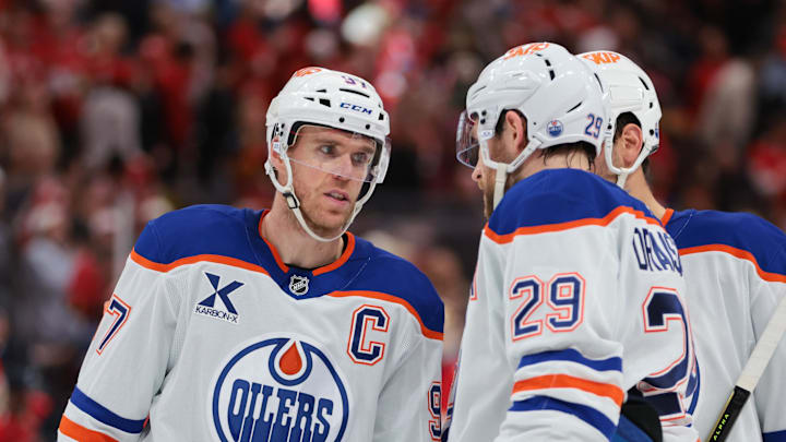 Nov 22, 2025; Sunrise, Florida, USA; Edmonton Oilers center Connor McDavid (97) speaks to center Leon Draisaitl (29) against the Florida Panthers during the second period at Amerant Bank Arena. Mandatory Credit: Sam Navarro-Imagn Images