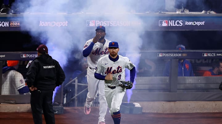 New York Mets outfielder Brandon Nimmo (9) takes the field against the Los Angeles Dodgers in game four of the NLCS for the 2024 MLB playoffs at Citi Field. 