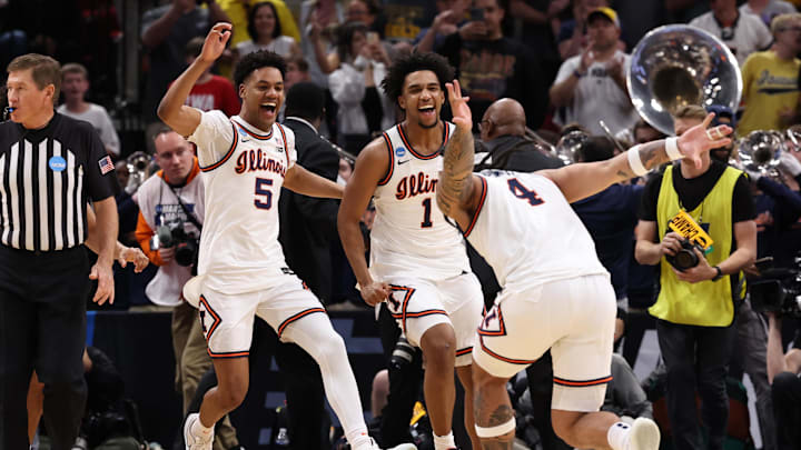Mar 28, 2026; Houston, TX, USA; Illinois Fighting Illini guard Kylan Boswell (4) and guard AJ Redd (5) and guard Brandon Lee (1) celebrate after defeating the Iowa Hawkeyes in an Elite Eight game of the South Regional of the men's 2026 NCAA Tournament at Toyota Center. Mandatory Credit: Troy Taormina-Imagn Images