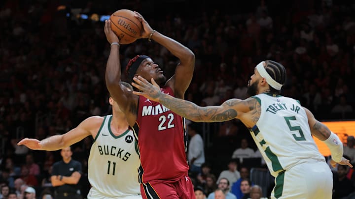 Nov 26, 2024; Miami, Florida, USA; Miami Heat forward Jimmy Butler (22) fakes a shot against Milwaukee Bucks guard Gary Trent Jr. (5) during the second quarter at Kaseya Center. Mandatory Credit: Sam Navarro-Imagn Images Nov 26, 2024; Miami, Florida, USA; Miami Heat forward Jimmy Butler (22) fakes a shot against Milwaukee Bucks guard Gary Trent Jr. (5) during the second quarter at Kaseya Center. Mandatory Credit: Sam Navarro-Imagn Images