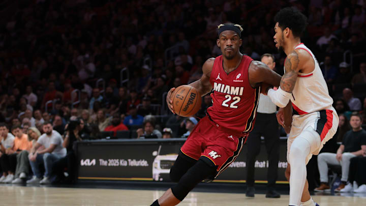 Jan 21, 2025; Miami, Florida, USA; Miami Heat forward Jimmy Butler (22) drives to the basket past Portland Trail Blazers guard Anfernee Simons (1) during the second quarter at Kaseya Center. Mandatory Credit: Sam Navarro-Imagn Images Jan 21, 2025; Miami, Florida, USA; Miami Heat forward Jimmy Butler (22) drives to the basket past Portland Trail Blazers guard Anfernee Simons (1) during the second quarter at Kaseya Center. Mandatory Credit: Sam Navarro-Imagn Images
